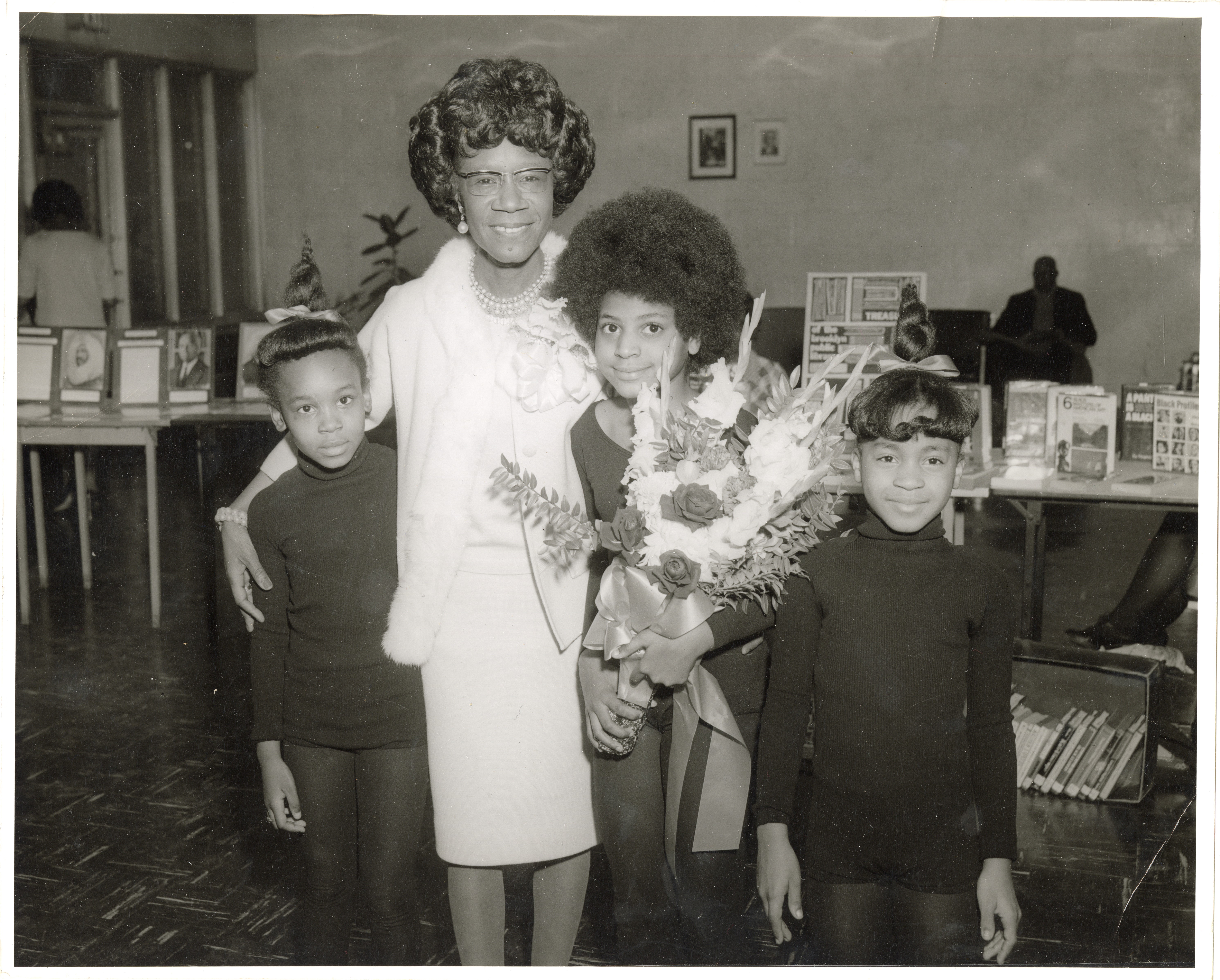 Shirley Chisholm with three children.